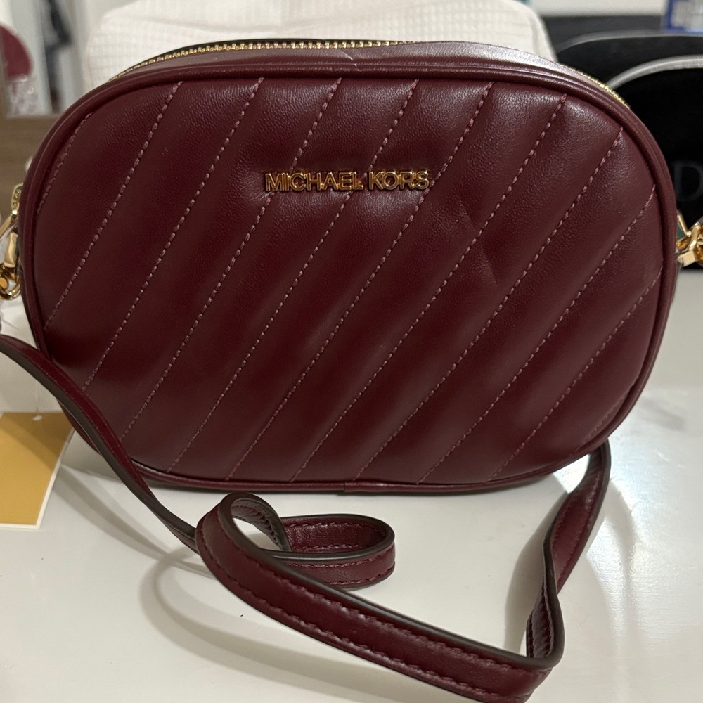 Michael Kors SM Oval Camera XBody in Merlot